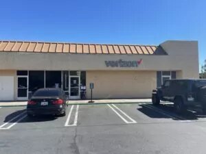 Garden Grove, California Verizon Store in beige building with ample parking.