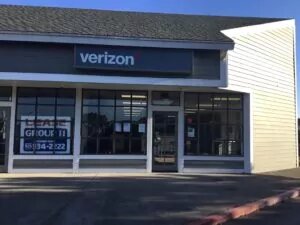 Fort Bragg, California VerizonÂ Store with large store front windows and glass door.