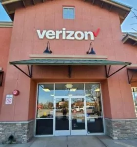 Paso Robles California Verizon store exterior, large red building with grey brick skirt.