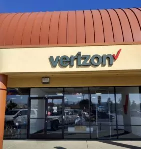 Pittsburg, California VerizonÂ Store located in shopping mall with signage above doorway.