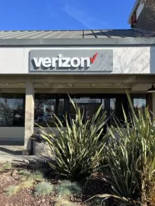 Rohnert Park California Verizon Store with large plants outside front door.