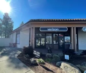 Sebastopol, California Verizon store, exterior with mesa roof shingles and storefront windows.