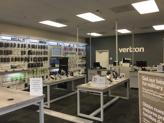 Atascadero, California VerizonÂ store interior with display tables and display wall racks.