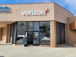 Capitola, California Verizon store exterior entrance with door propped open for customers. 