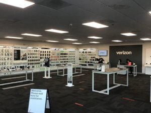 Interior of Verizon store showing display walls of Verizon merchandise. 