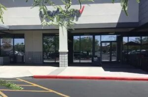 Verizon located in stand alone grey building storefront windows.