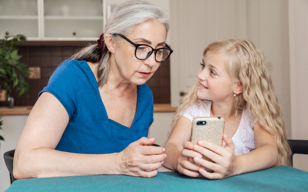Grandmother showing granddaughter Android Hidden Tricks