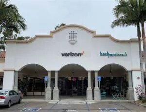 Goleta, California VerizonÂ store. With old Spanish style design with arching roof and columns.