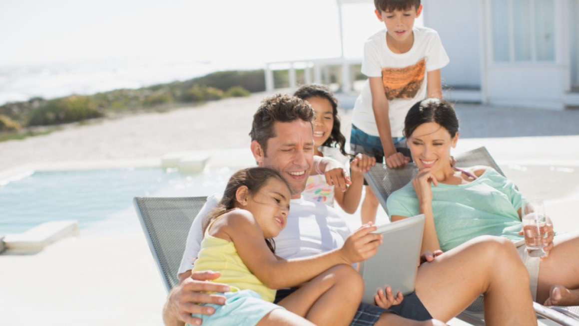 Family enjoying beach in summer