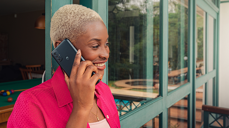 Black lady talking on smartphone and smiling Victra Verizon