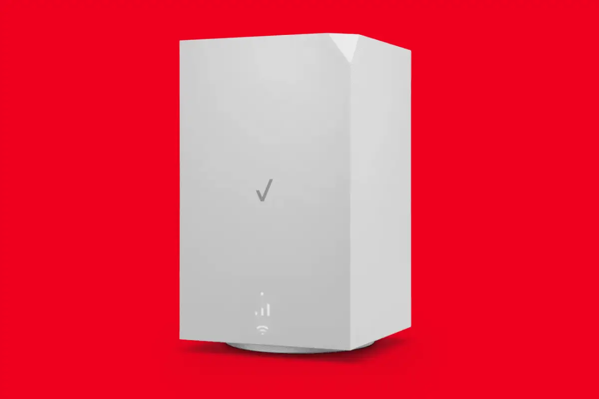 White Verizon 5G home internet gateway device on a red background.