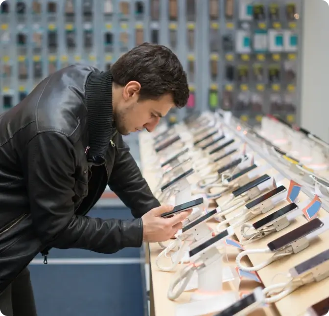 A man shopping for a new smartphone at Verizon Wireless.