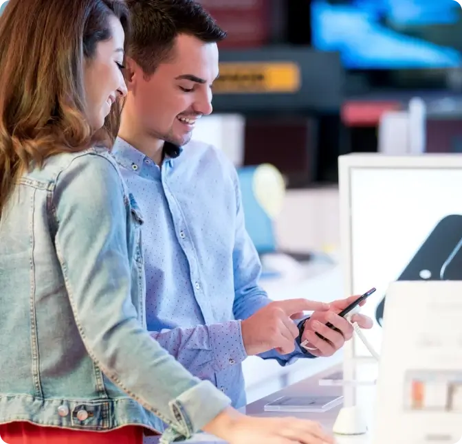 Man and woman shop for smartphones at the Verizon store in Plymouth.