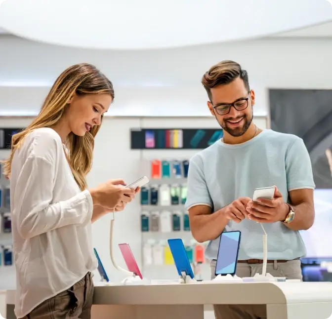 A couple shopping for smartphones at the Verizon store.