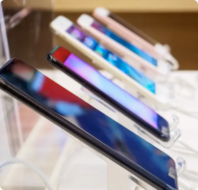 Smartphones lined up in a display at the Verizon store.